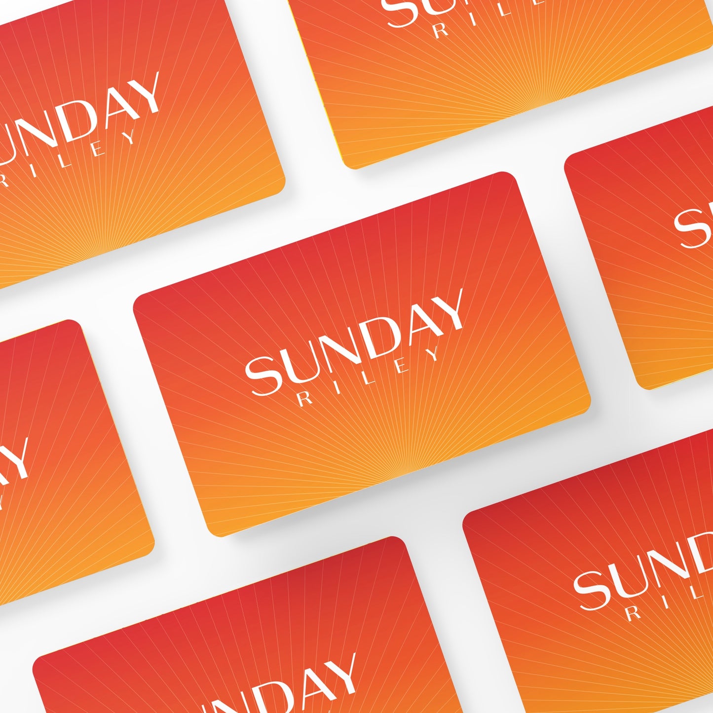 Multiple Sunday Riley Gift Cards layed down in symmetry on a white background