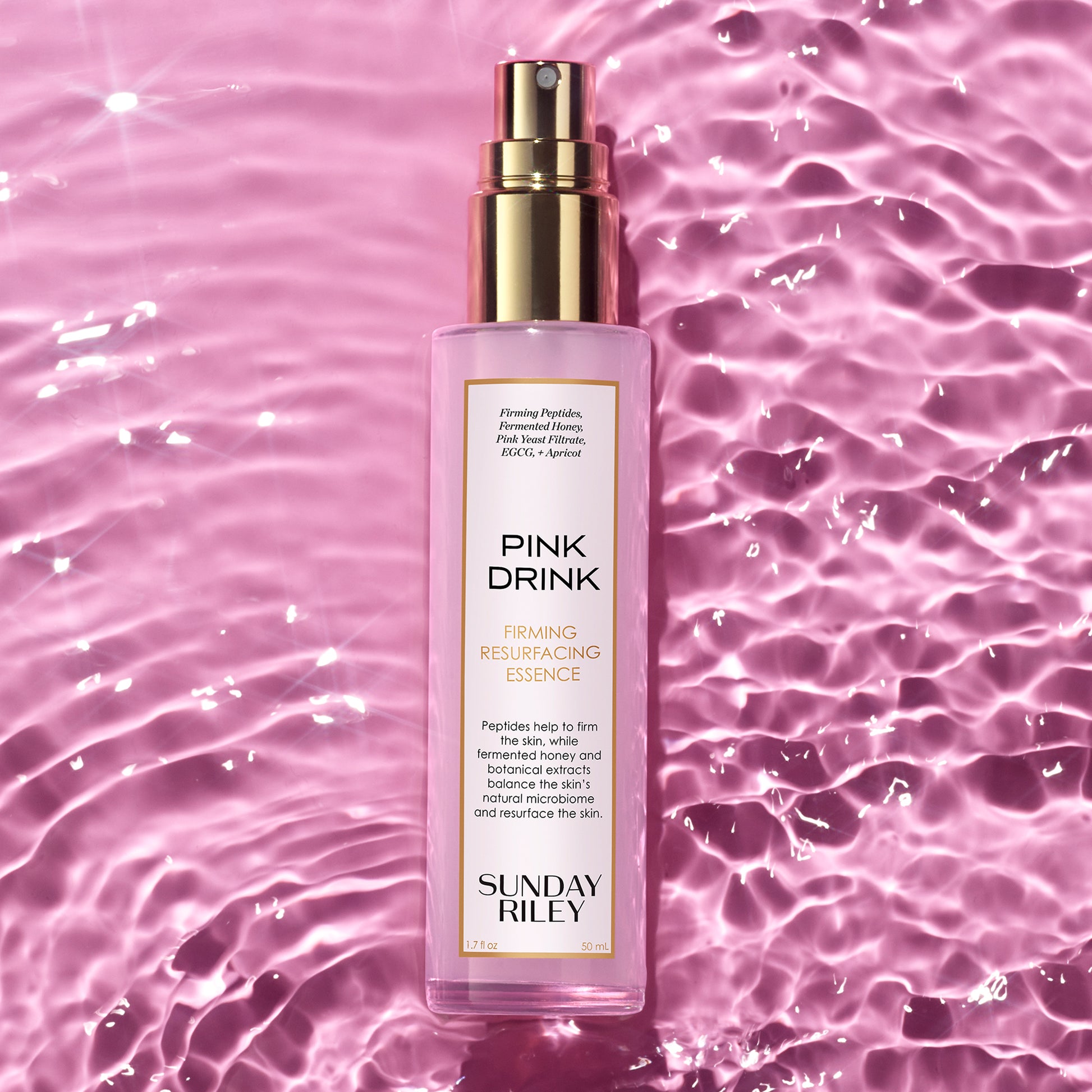Pink Drink on water rippling, think pink swimming pool