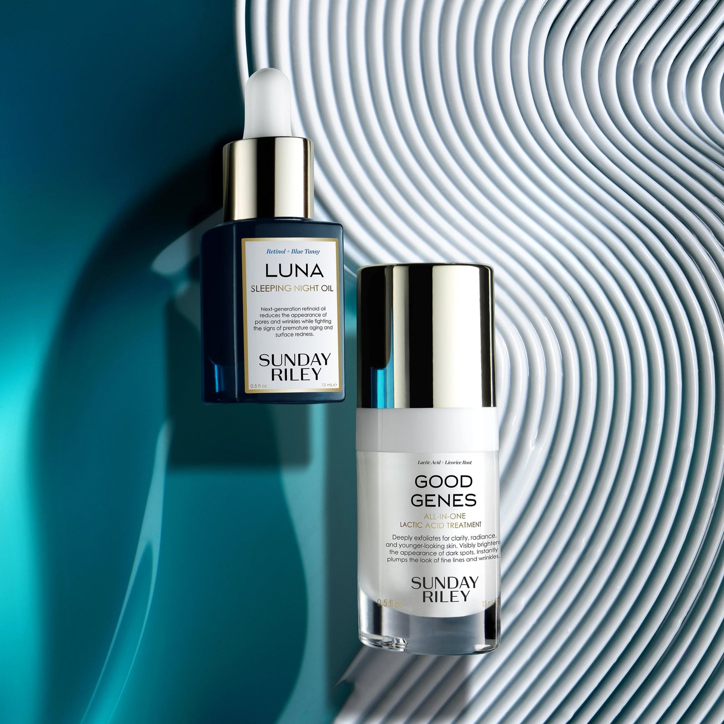 Luna Sleeping Night Oil laying over a blue oil and Good Genes laying over a white texture goop