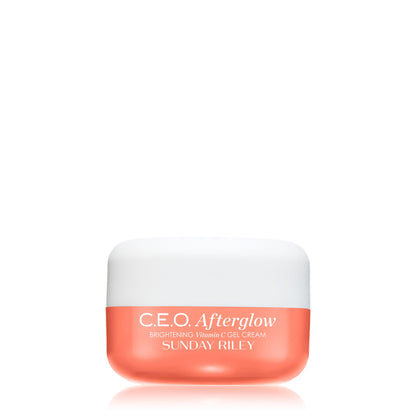 A jar of 'C.E.O. Afterglow' brightening thermodynamic cream by Sunday Riley, with a white lid and a pink label.