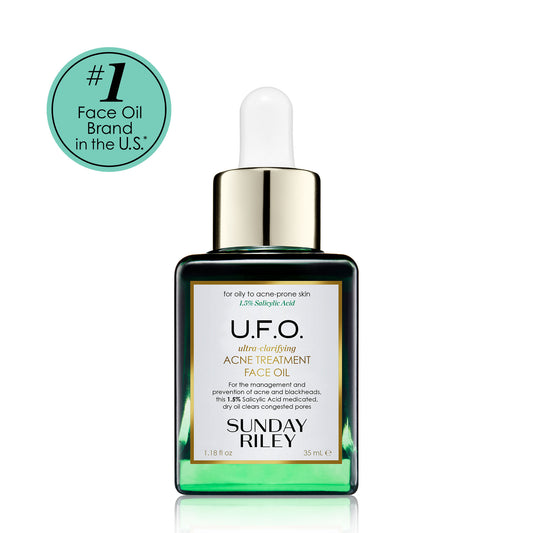 U.F.O. Acne Treatment Face Oil in a green gradient glass bottle with silicon dropper.