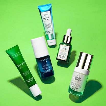 Ceramic Slip, Good Genes, U.F.O, A+ and Saturn bottles lay over a vibrant green background with shadow