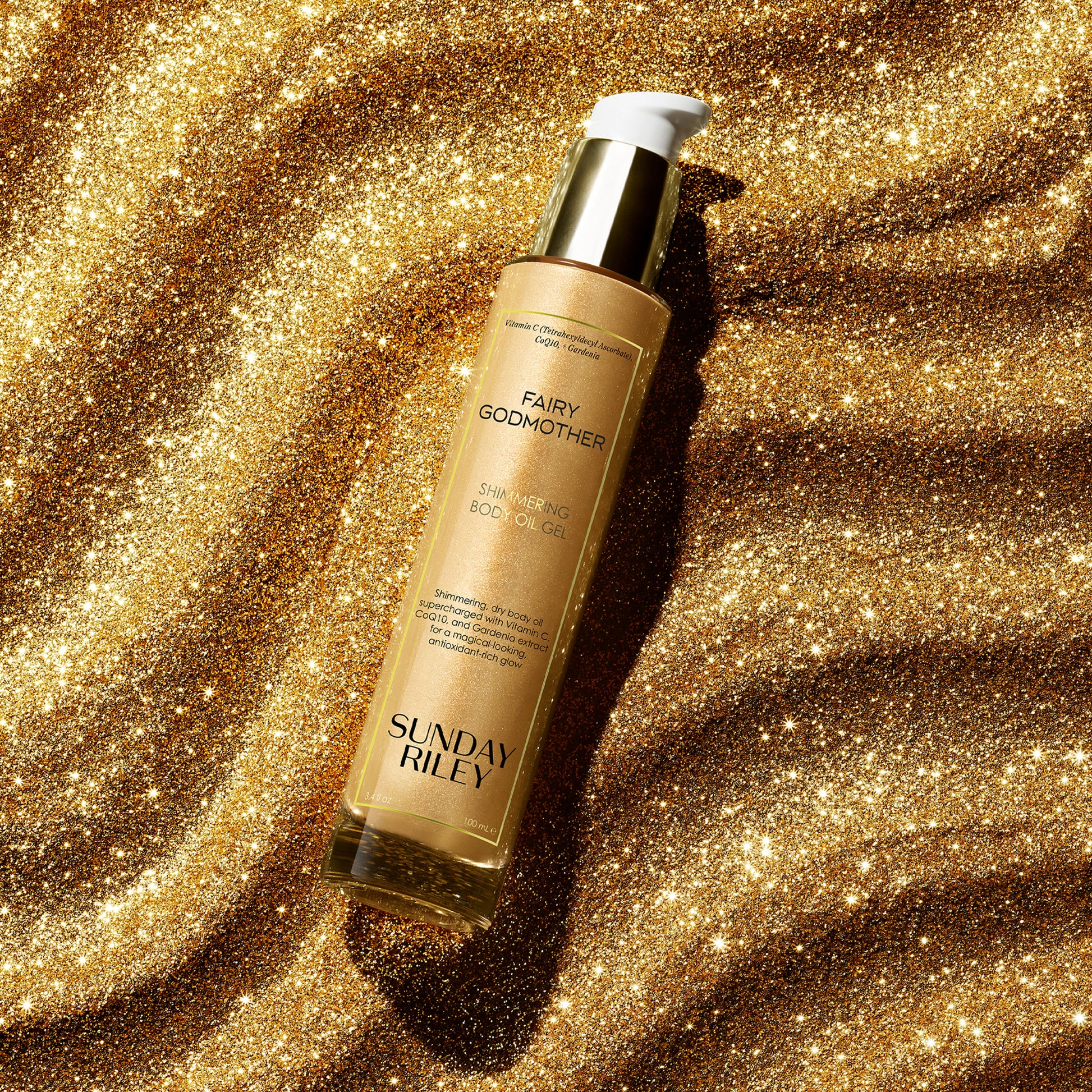 Fairy Godmother bottle lay over shiny gold texture powder