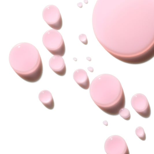 Pink Drink Liquid drops on a white surface