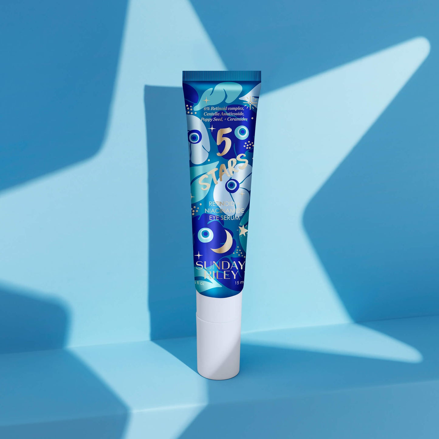 5 Stars bottle standing on a blue shelf with blue background with a star shaped flashlight