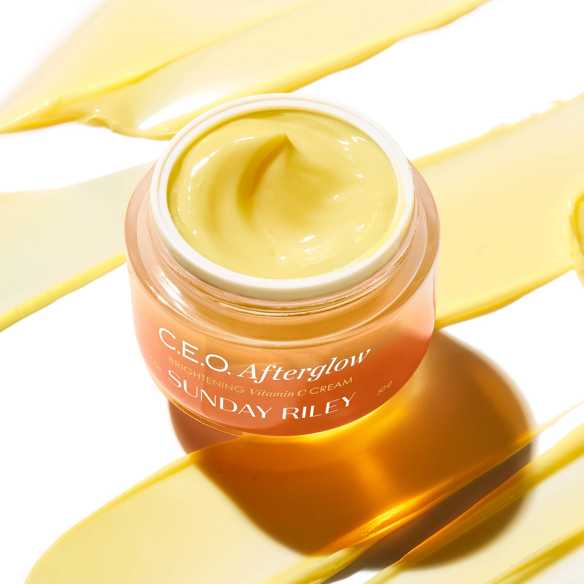 C.E.O. Afterglow jar on top of yellow goop smear