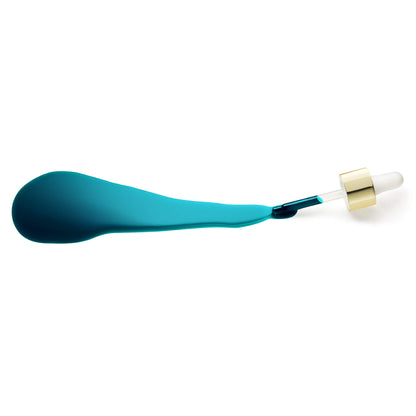 Lay down of Luna Sleeping Night Oil with lay down dropper and blue oil spill