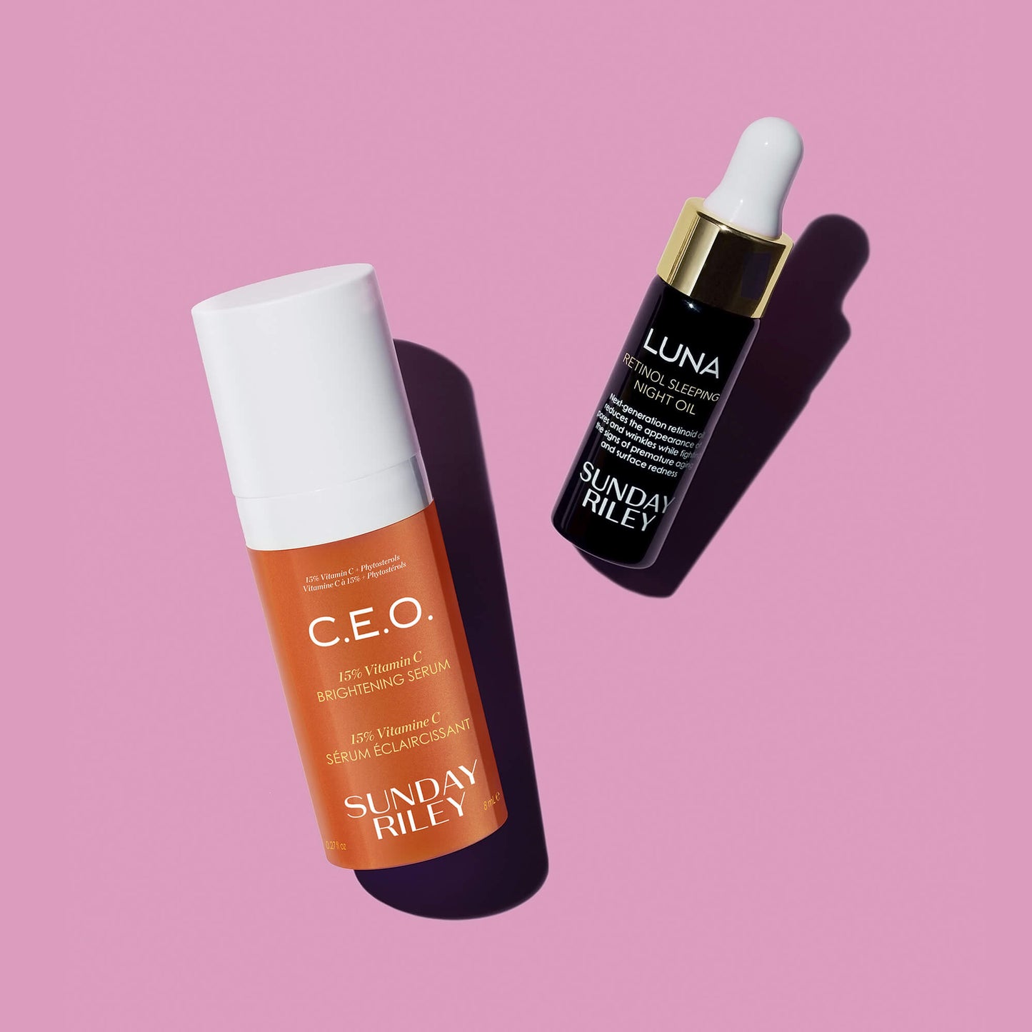 C.E.O. Serum and Luna bottles on a dark pink background with shadow