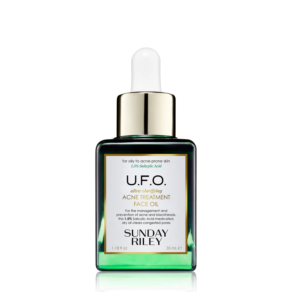 U.F.O. Acne Treatment Face Oil in a green gradient glass bottle with silicon dropper.
